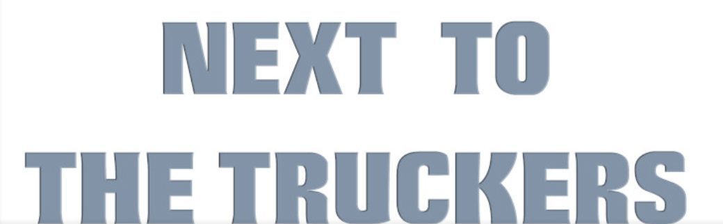 La vecchia copertina Facebook: la scritta Next to the Truckers in grigio su bianco